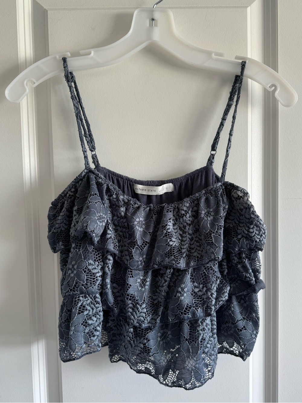 Altar'd State tiered lace ruffle tank top with adjustable spaghetti straps.